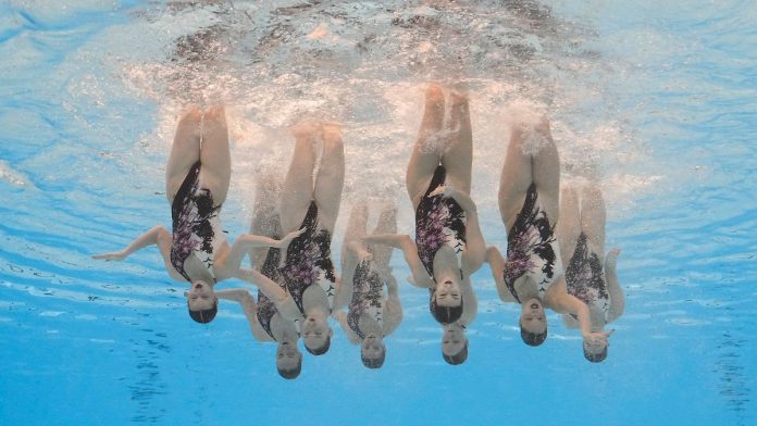 A synchronized team swims between war and World Cup gold
